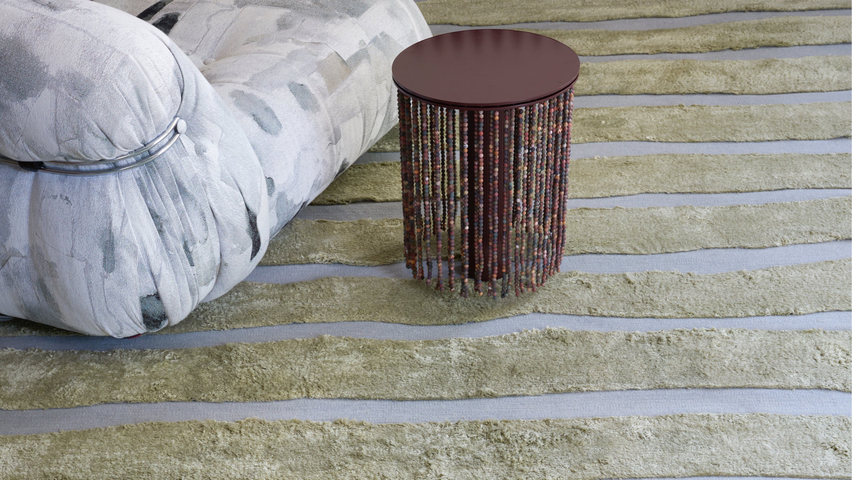 A rug in a living room with a lamp