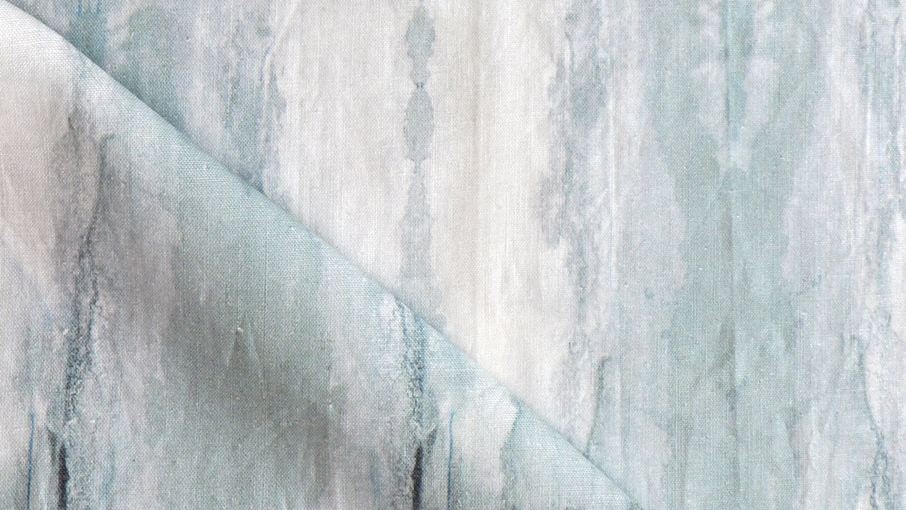 A close up of a blue and white marbled fabric