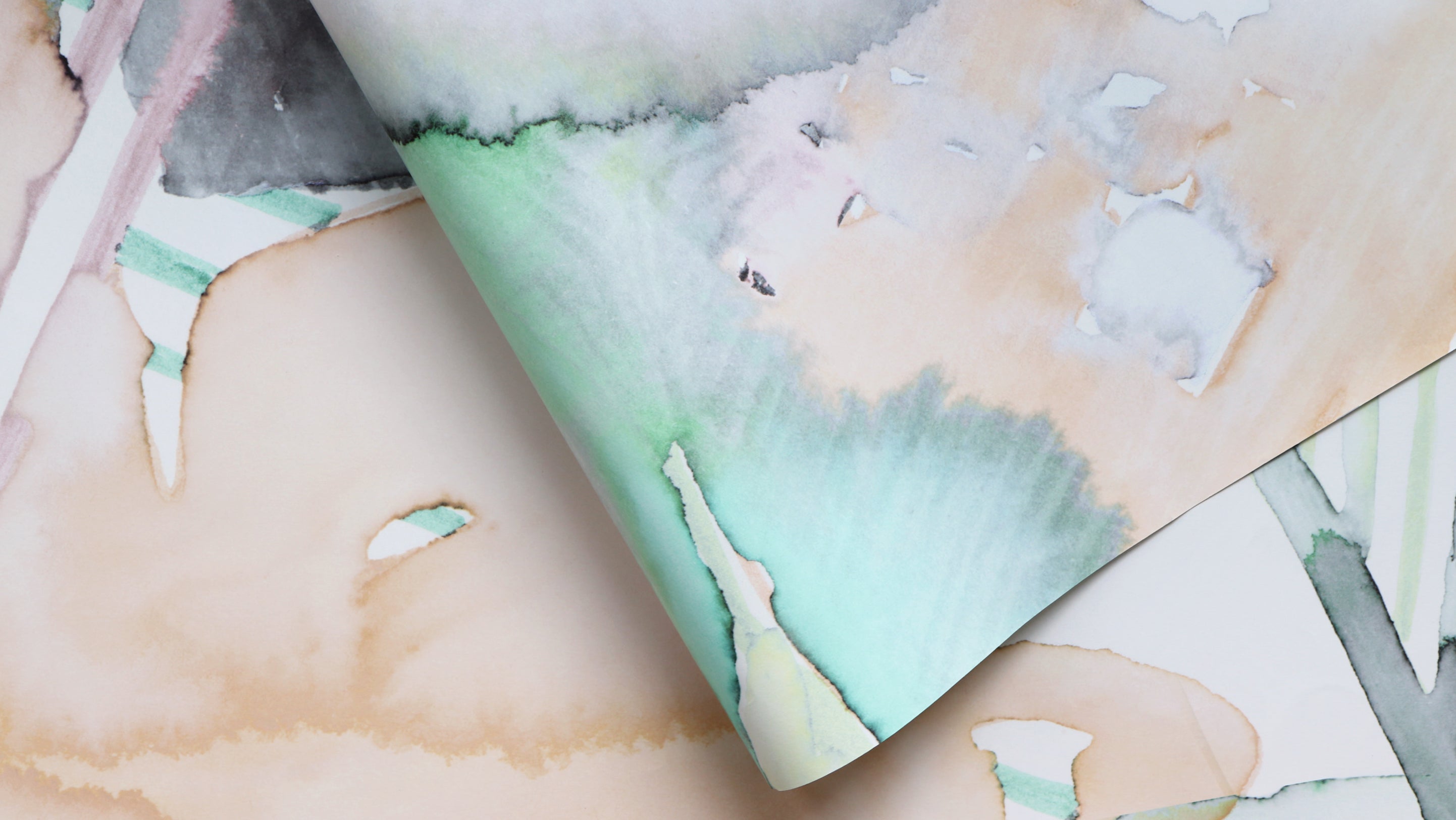 A close up of a piece of wallpaper with watercolors