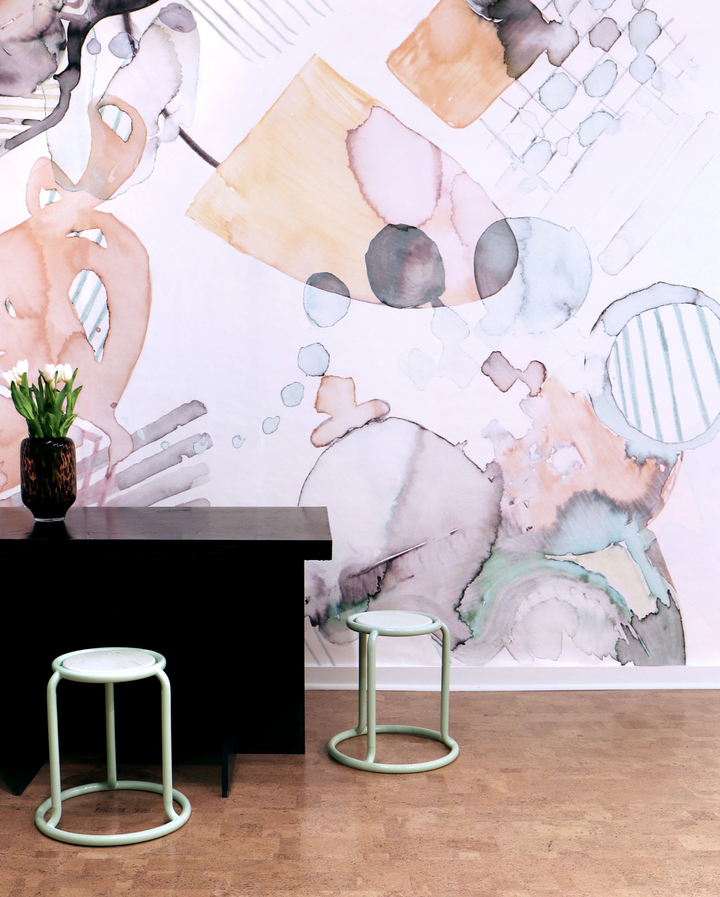 A black table with two stools in front