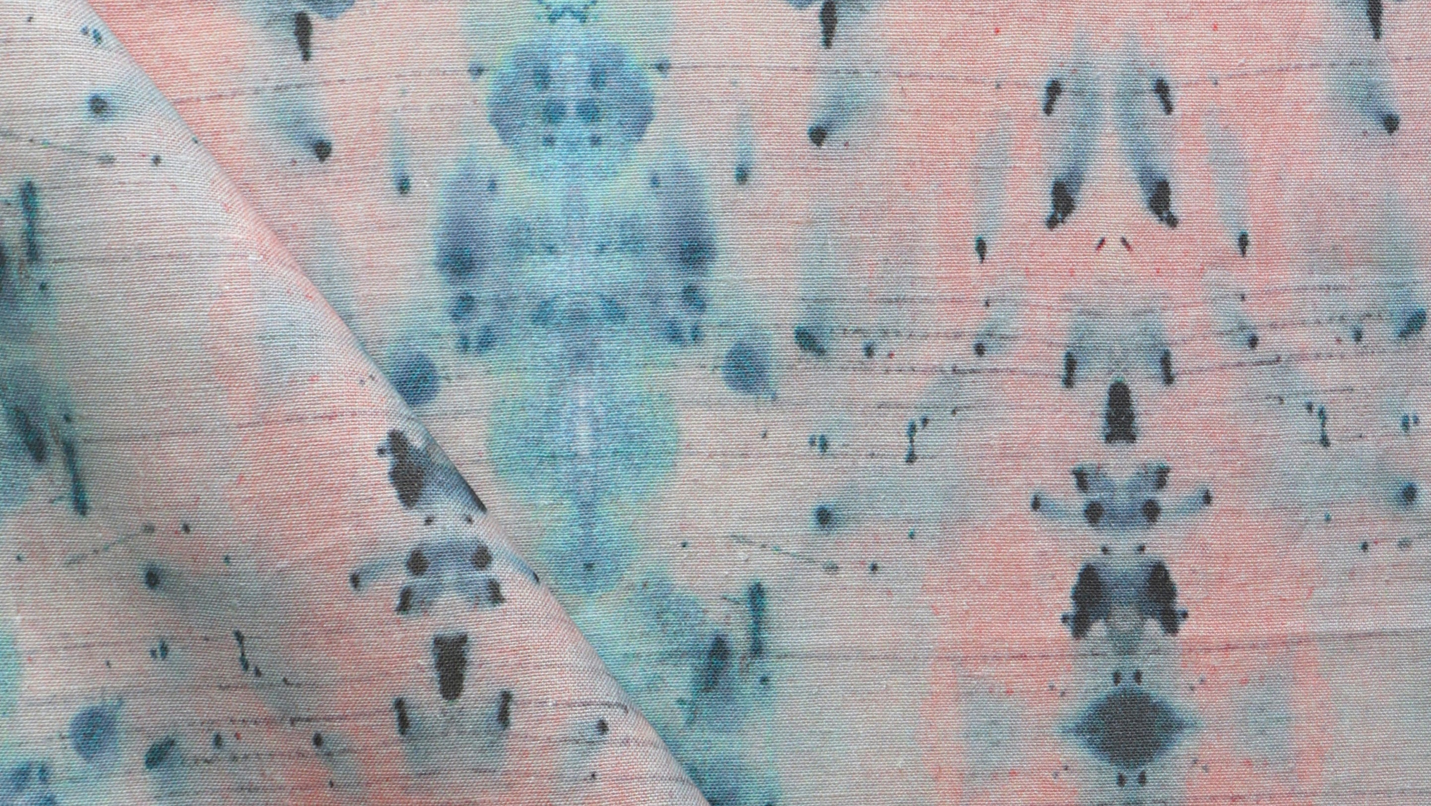 A close up of a pink and blue tie dyed fabric