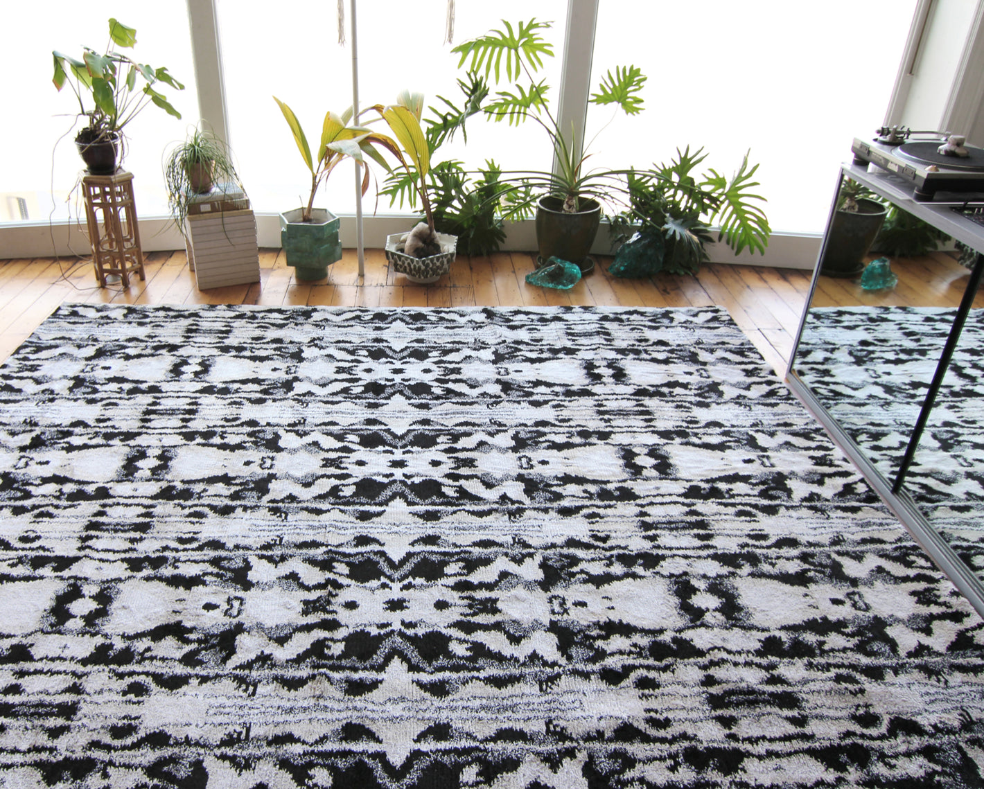 A black and white rug in a room