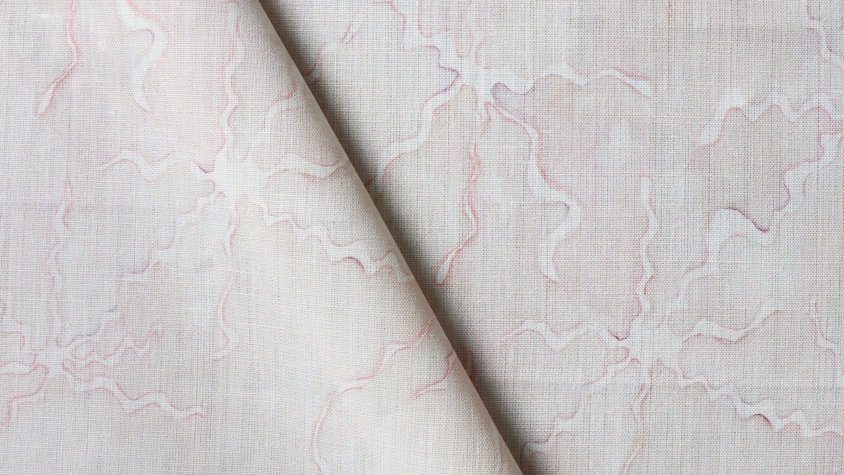 A close up of a pink and white fabric