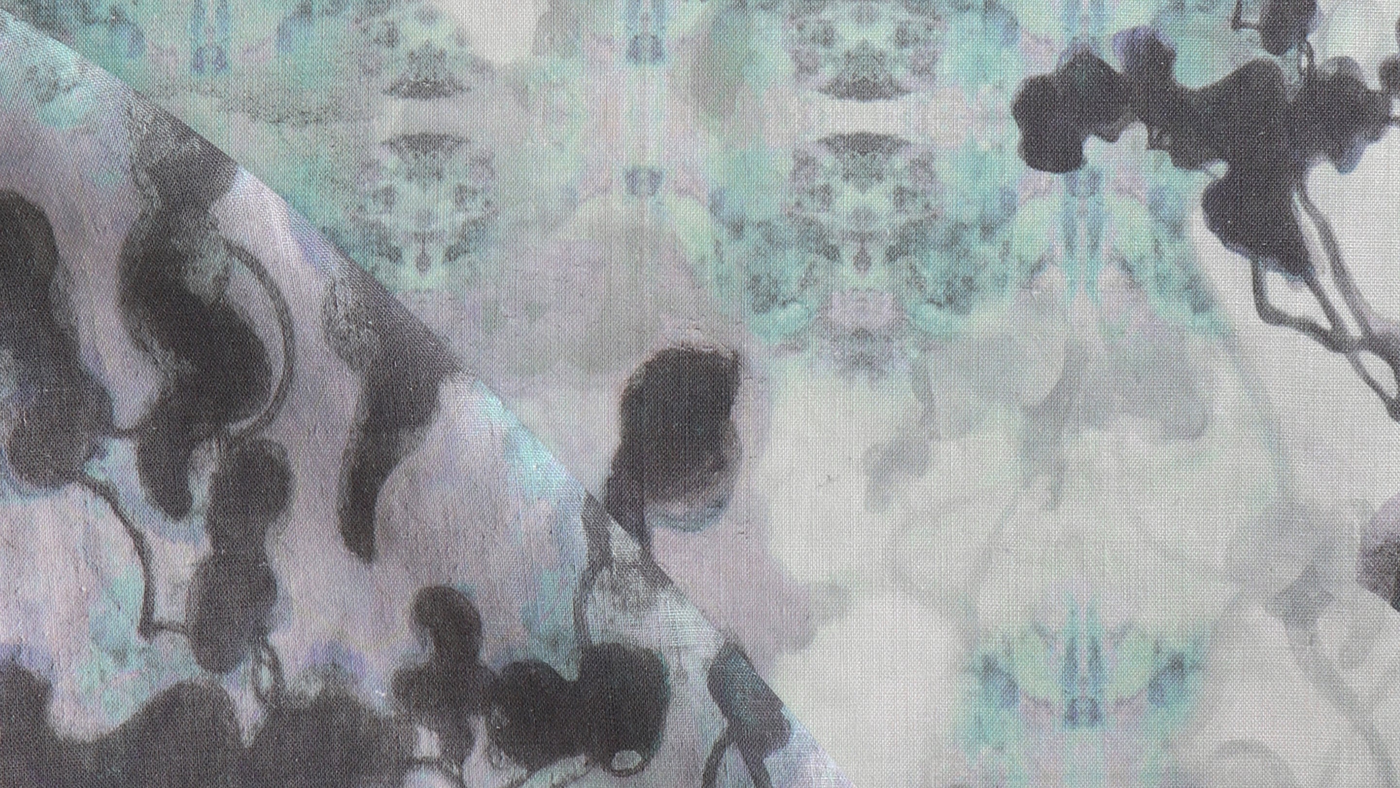 A close up of an abstract painting on a fabric