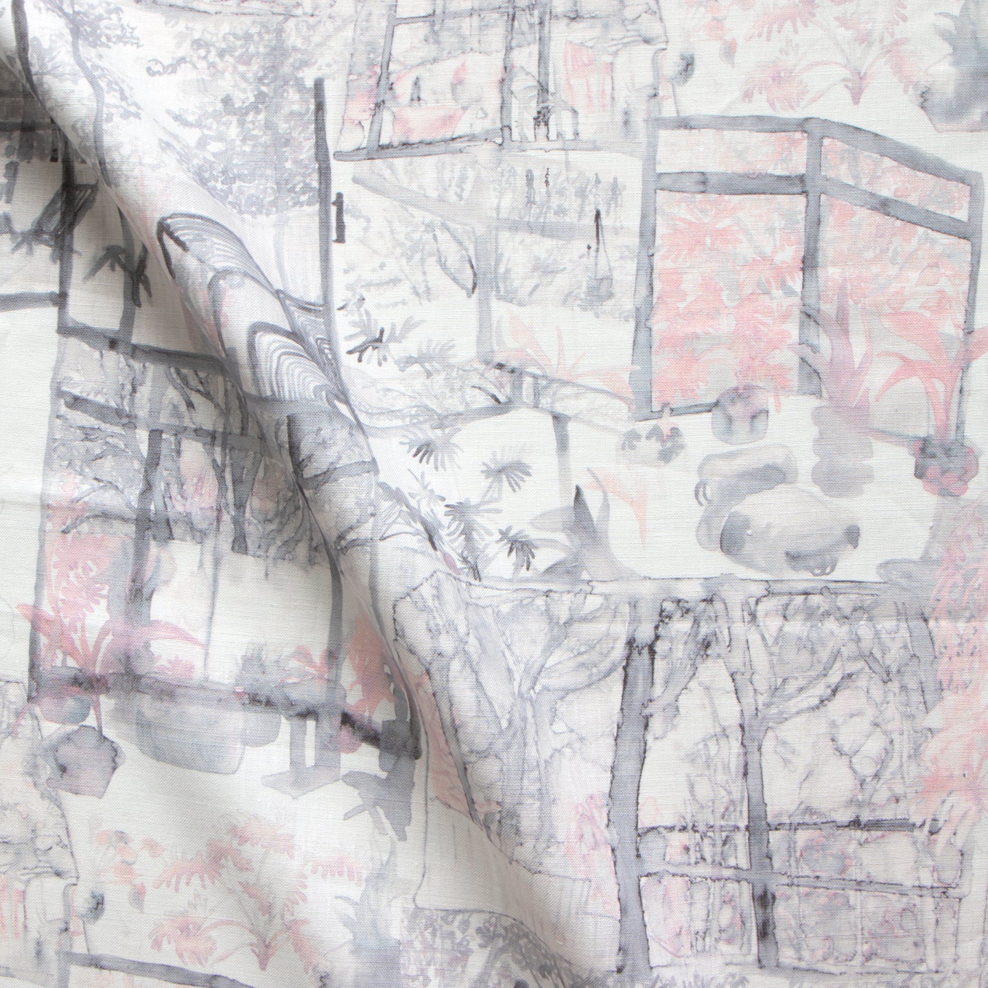 A close up of a white and pink fabric with a painting