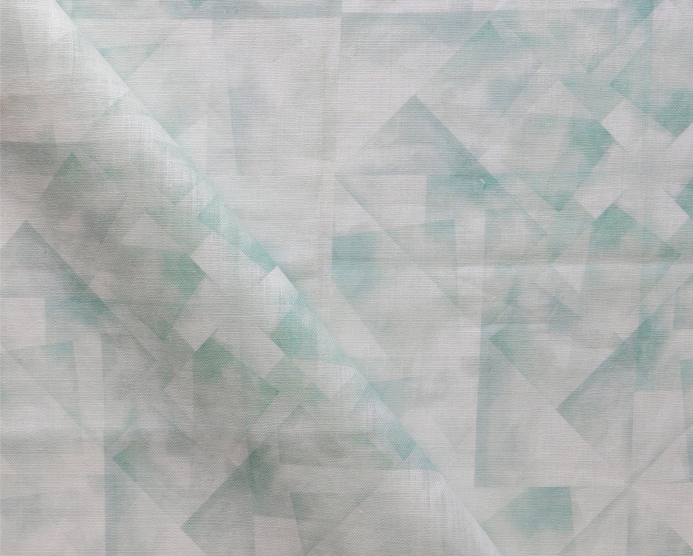 A close up of a green and white fabric