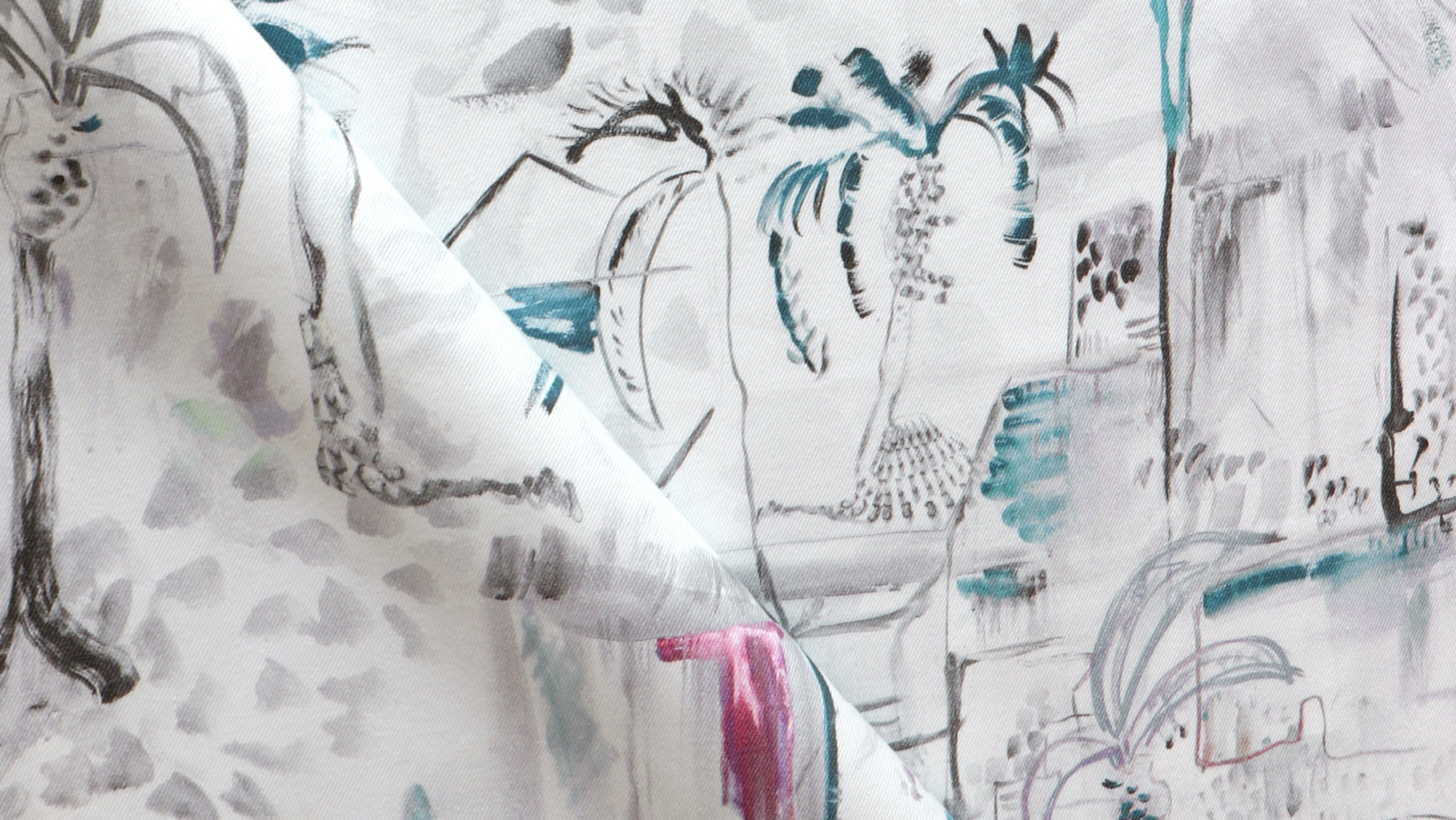 A close up of a white fabric with palm trees on it