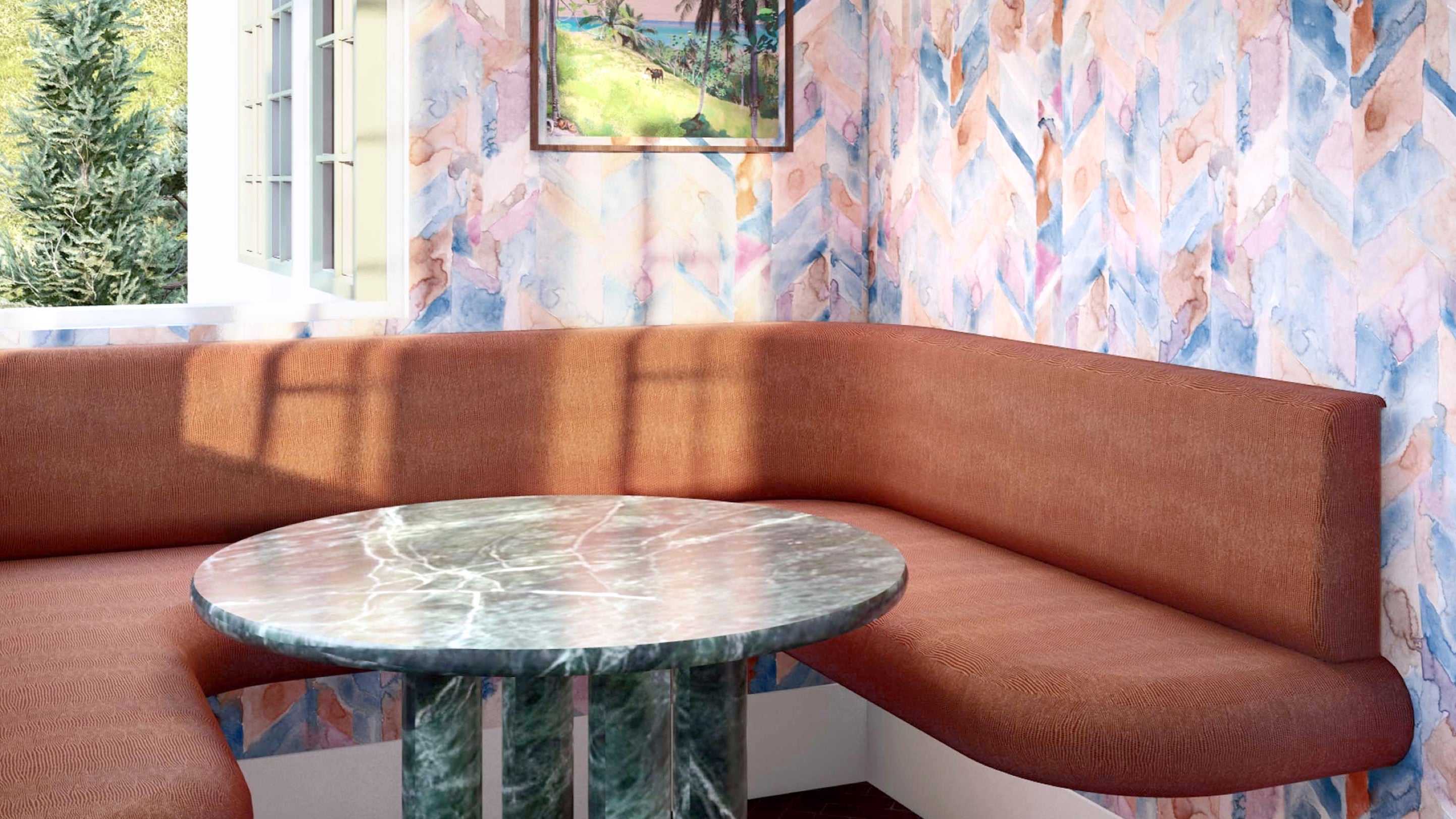 A table and chairs in a room with colorful wallpaper