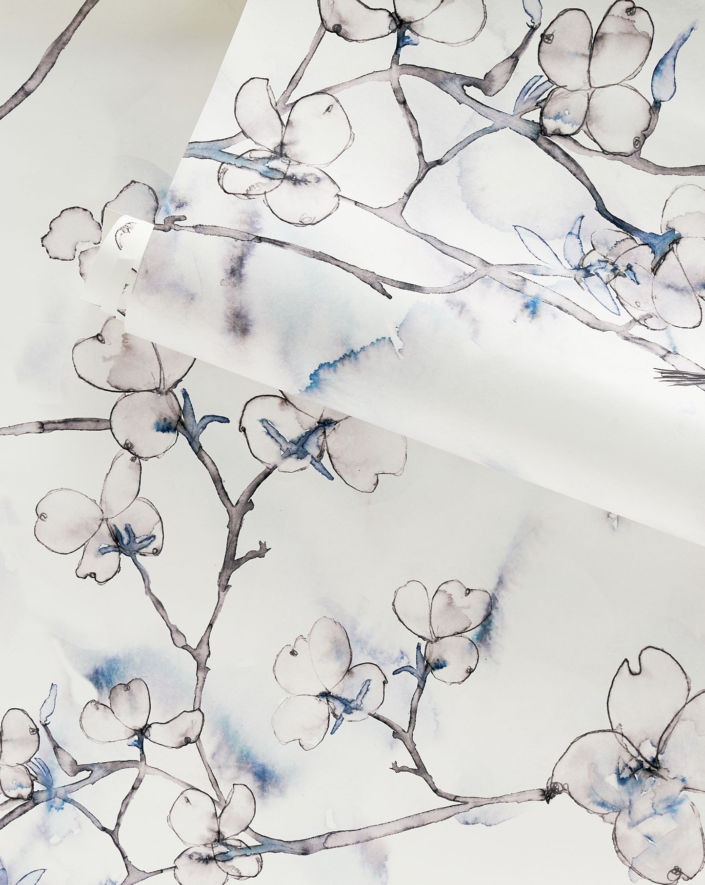 A custom luxury Dogwood Dreams Wallpaper Indigo with blue and white flowers on it in the Indigo colorway