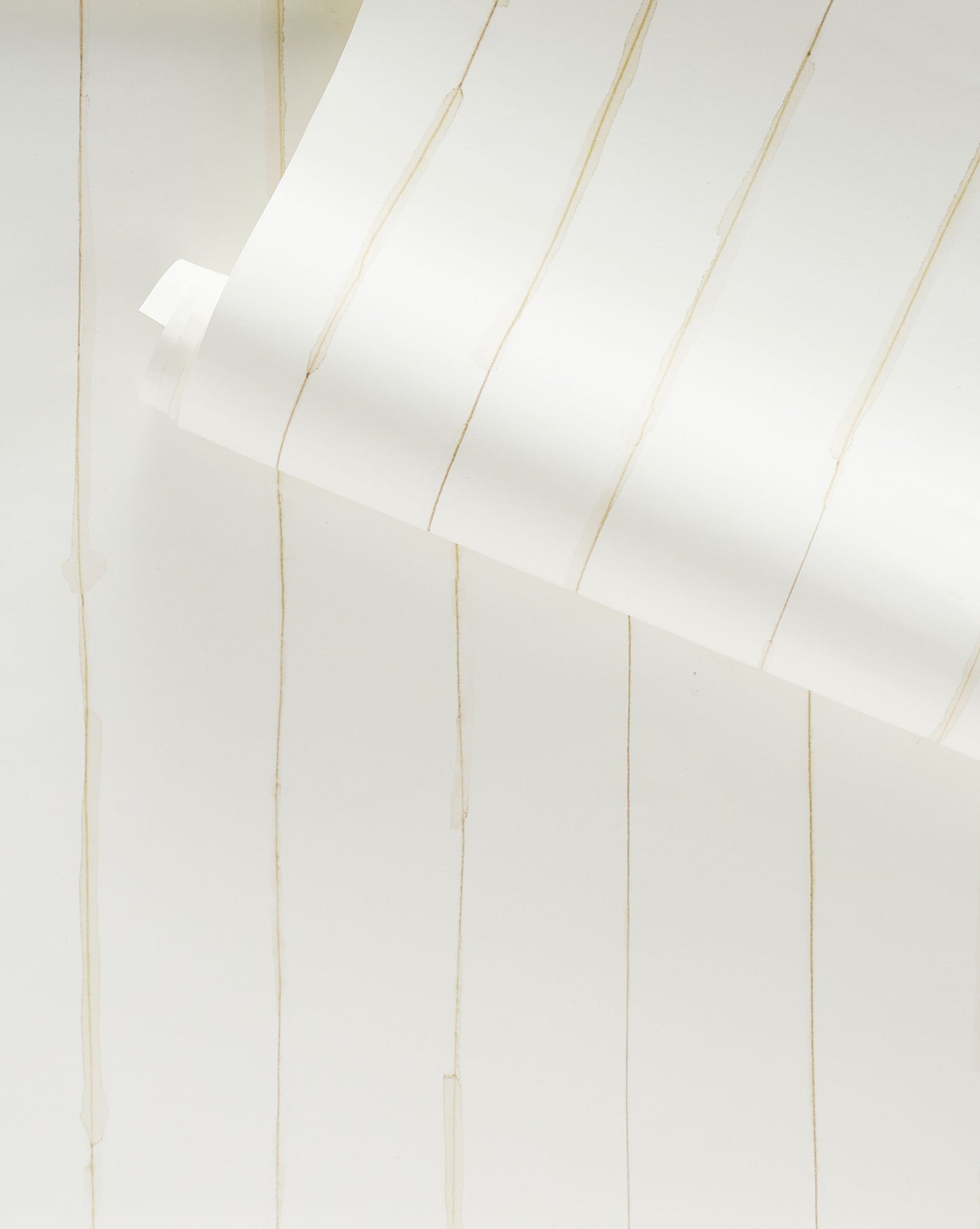 A close up of a Pen Stripe Wallpaper Flax on a white wallpaper