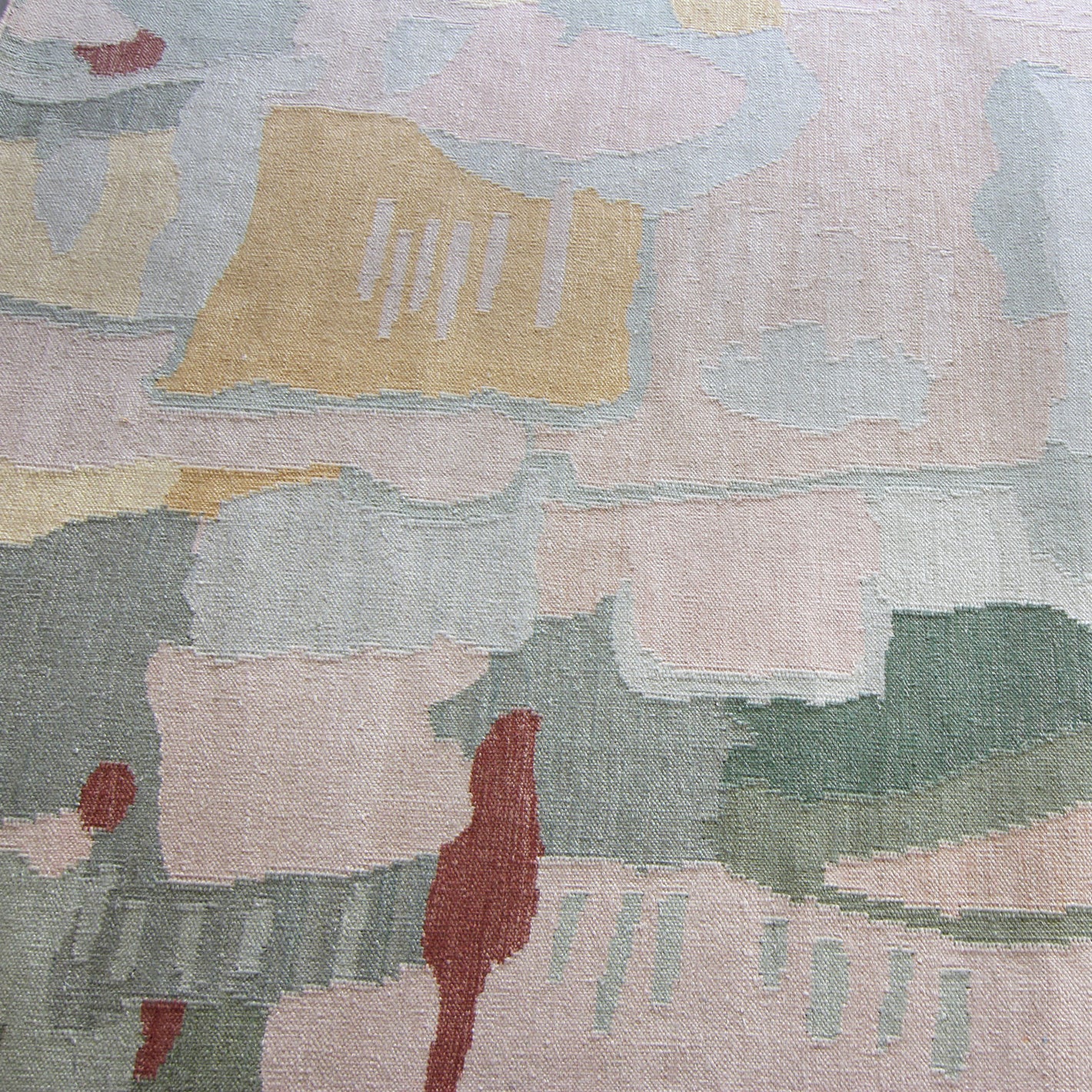 A rug with a pink and green pattern