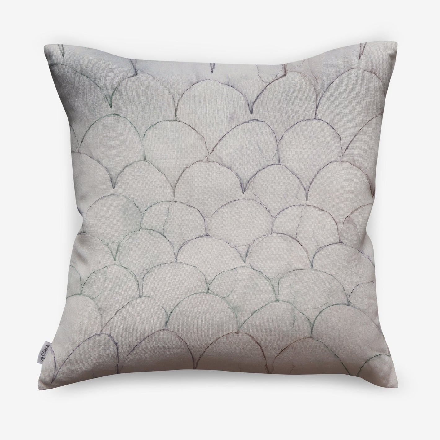 A white pillow with fish scales