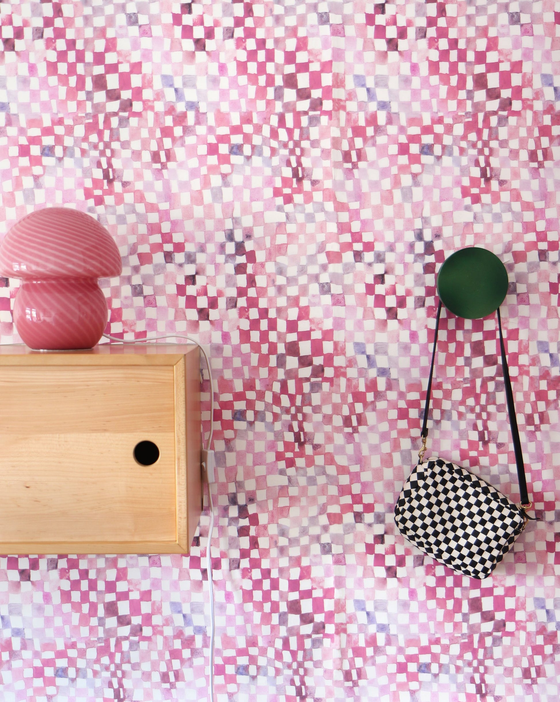 A high-end Chess Wallpaper Coral with a pink and white checkerboard pattern on a wall