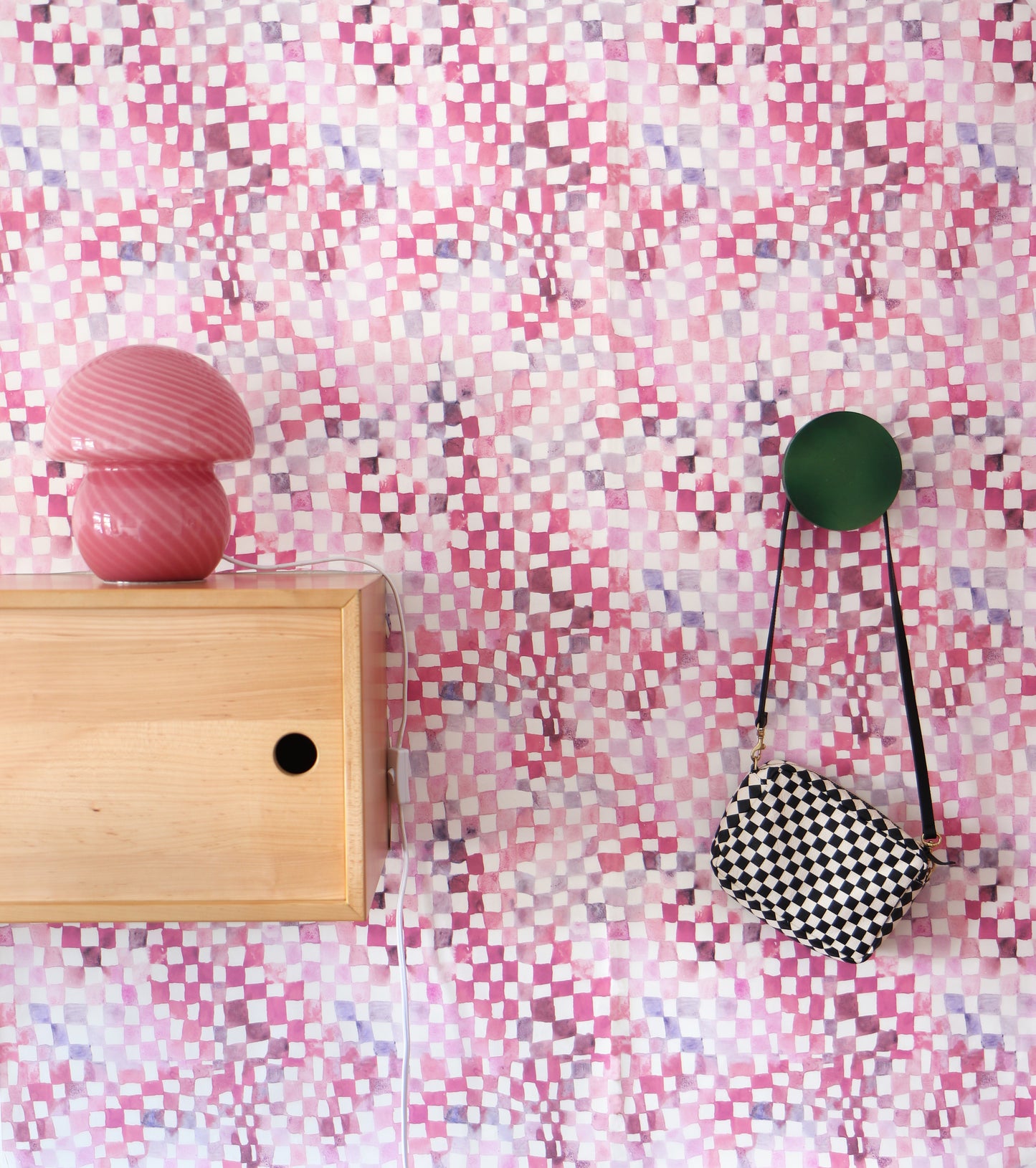 A high-end Chess Wallpaper Coral with a pink and white checkerboard pattern on a wall