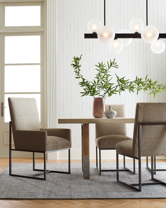 A dining room with Pen Stripe Wallpaper Ink table and chairs