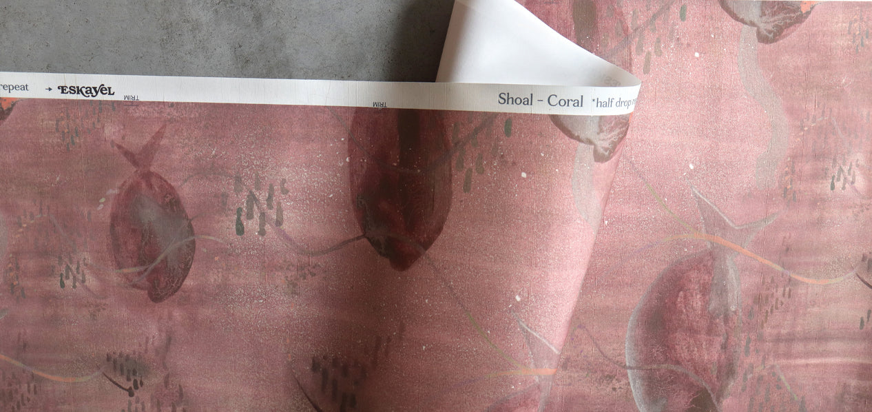 red silk wallpaper with a shoal of fish.