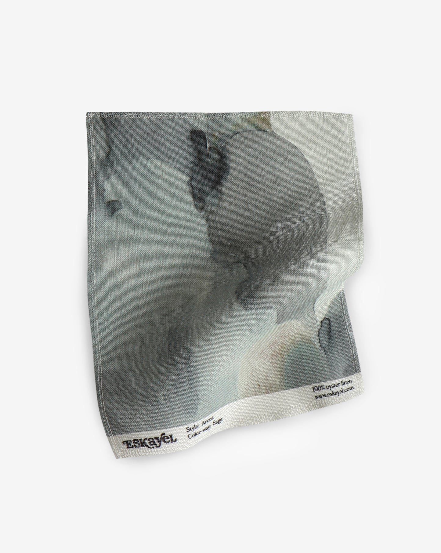 A fabric with an Arcos Fabric Sage design on it