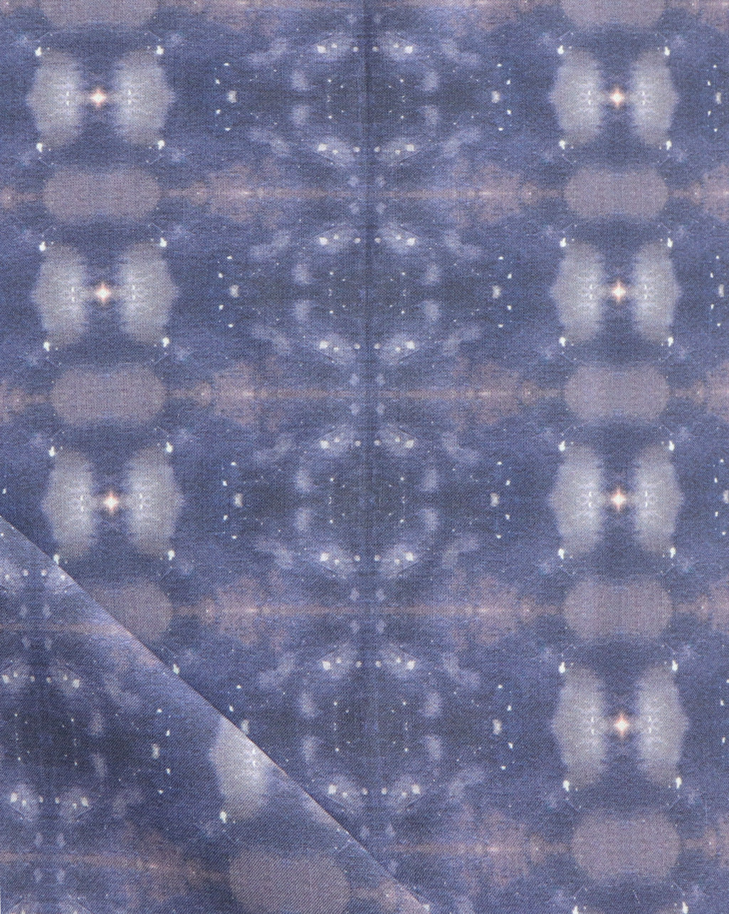 A blue and white fabric from the Jangala Collection with an Astral Fabric Night star pattern
