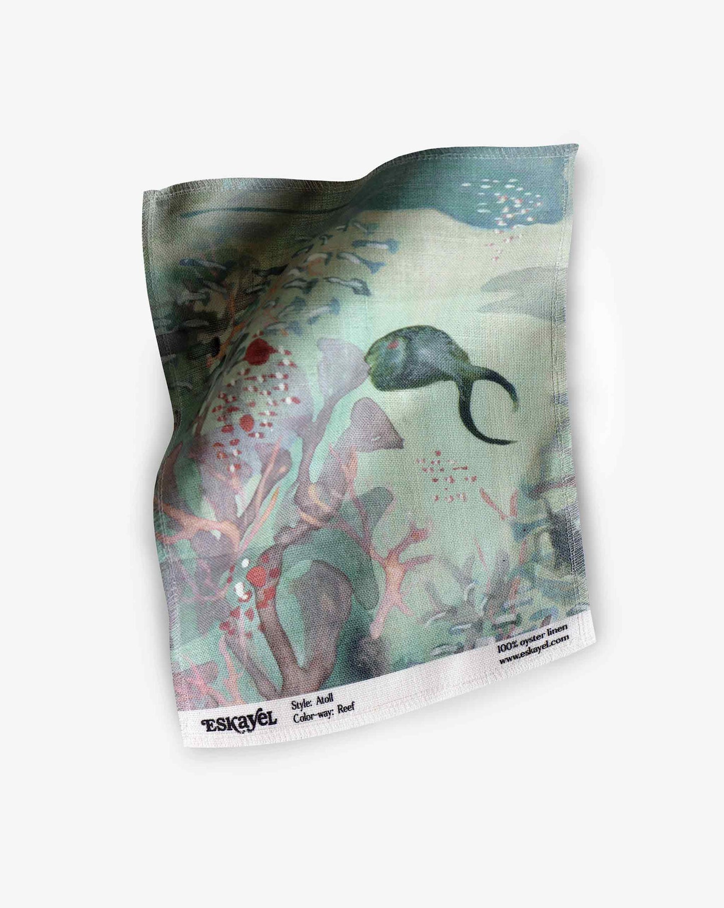 A swatch image of Eskayel’s Atoll print in the colorway Reef on linen fabric incorporating tones of green with hints of orange and red.