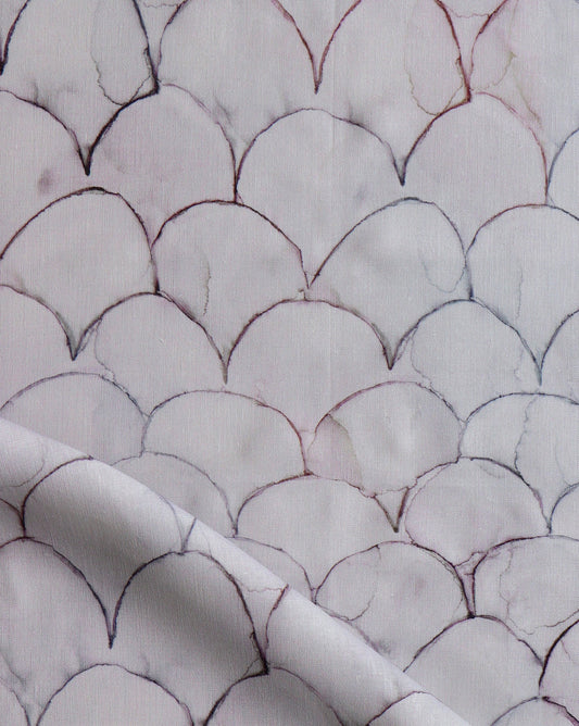 Baby Scallops fabric in Pomegranate introduces tones from mauve to blue into a geometric pattern of overlapping curves