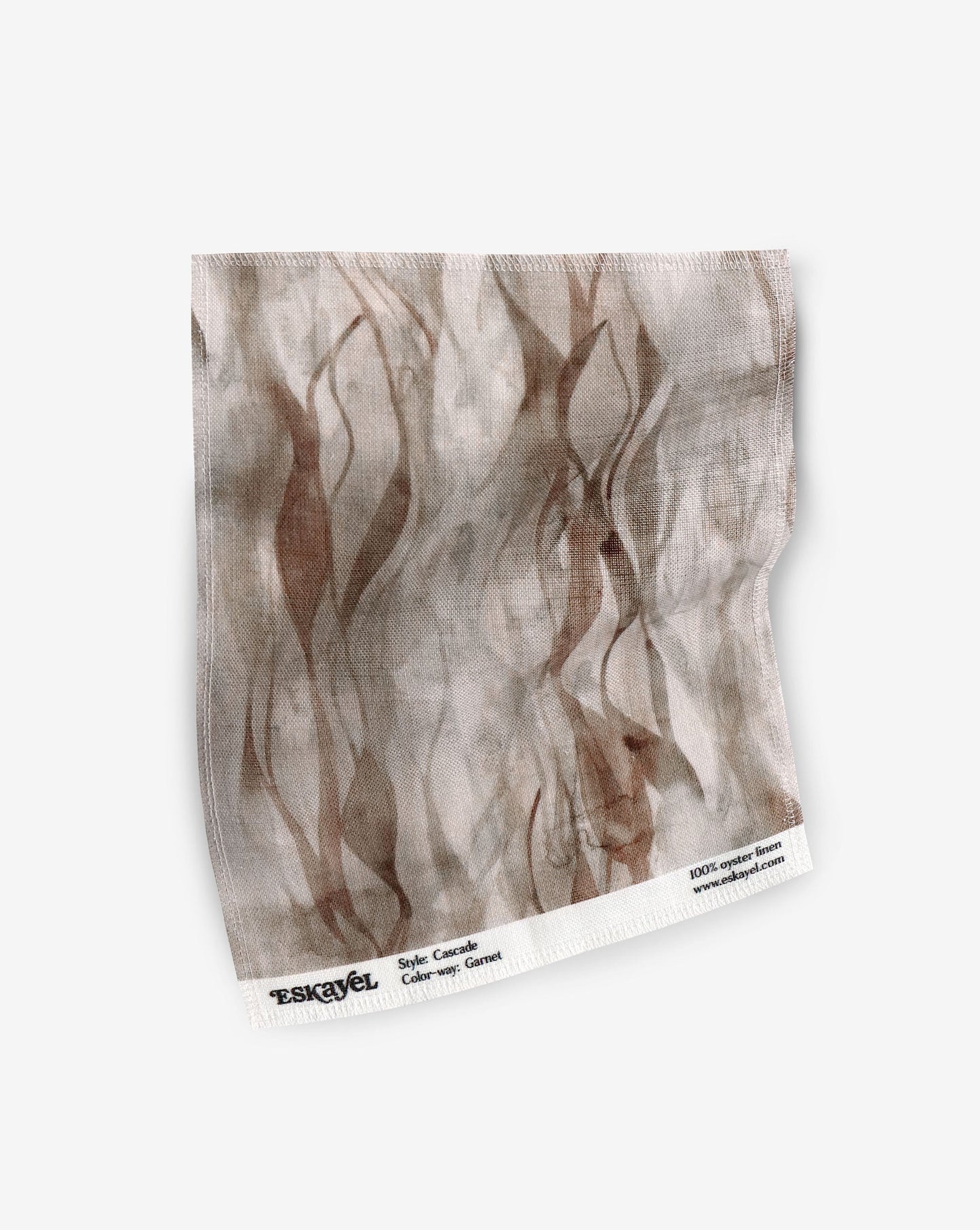 A fabric with our cascade pattern in garnet featuring a design that explores positive and negative space to evoke a feeling of vertical motion in shades of brown and beige.