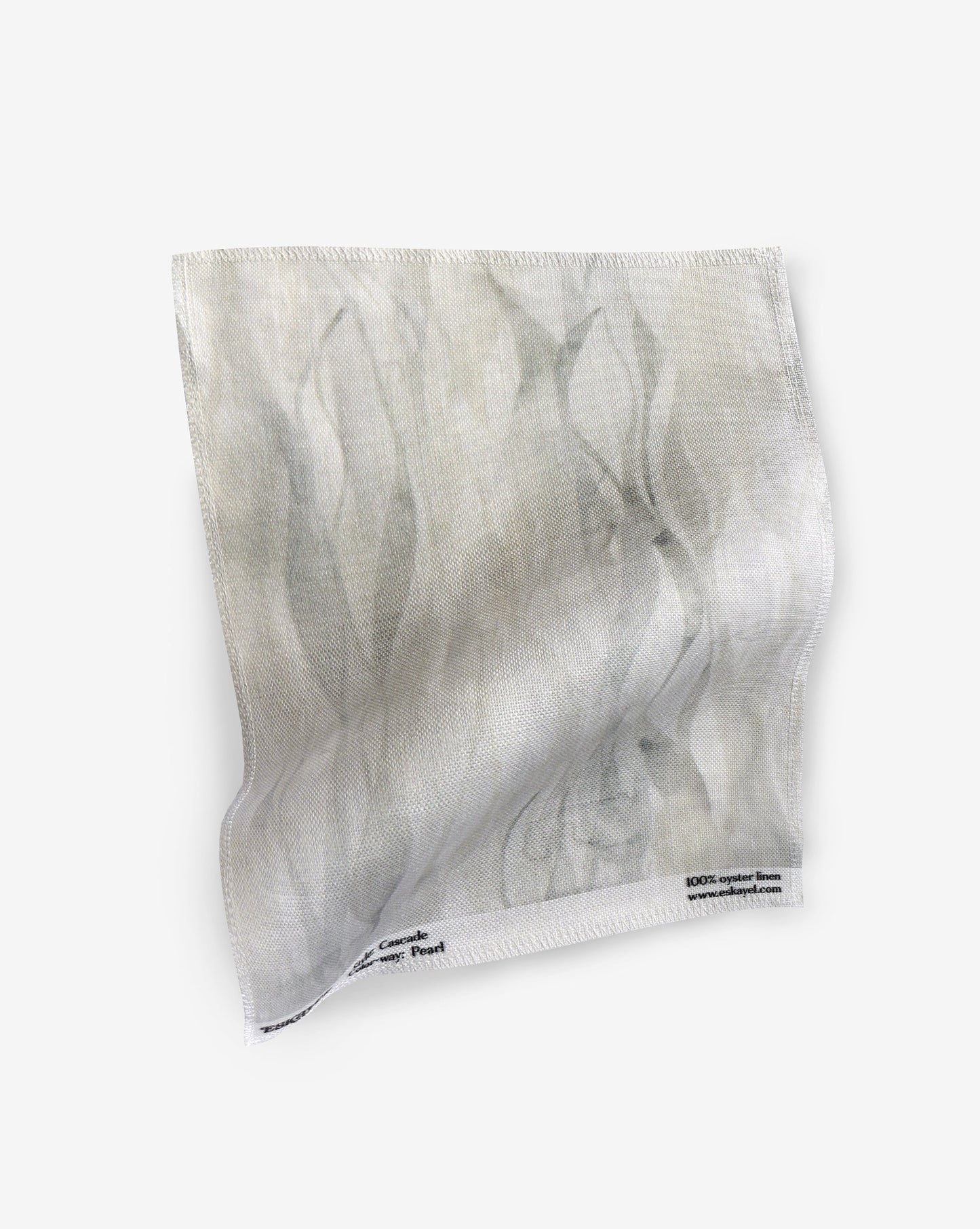 A fabric with our cascade pattern in pearl featuring a design that explores positive and negative space to evoke a feeling of vertical motion in shades of yellow and beige.