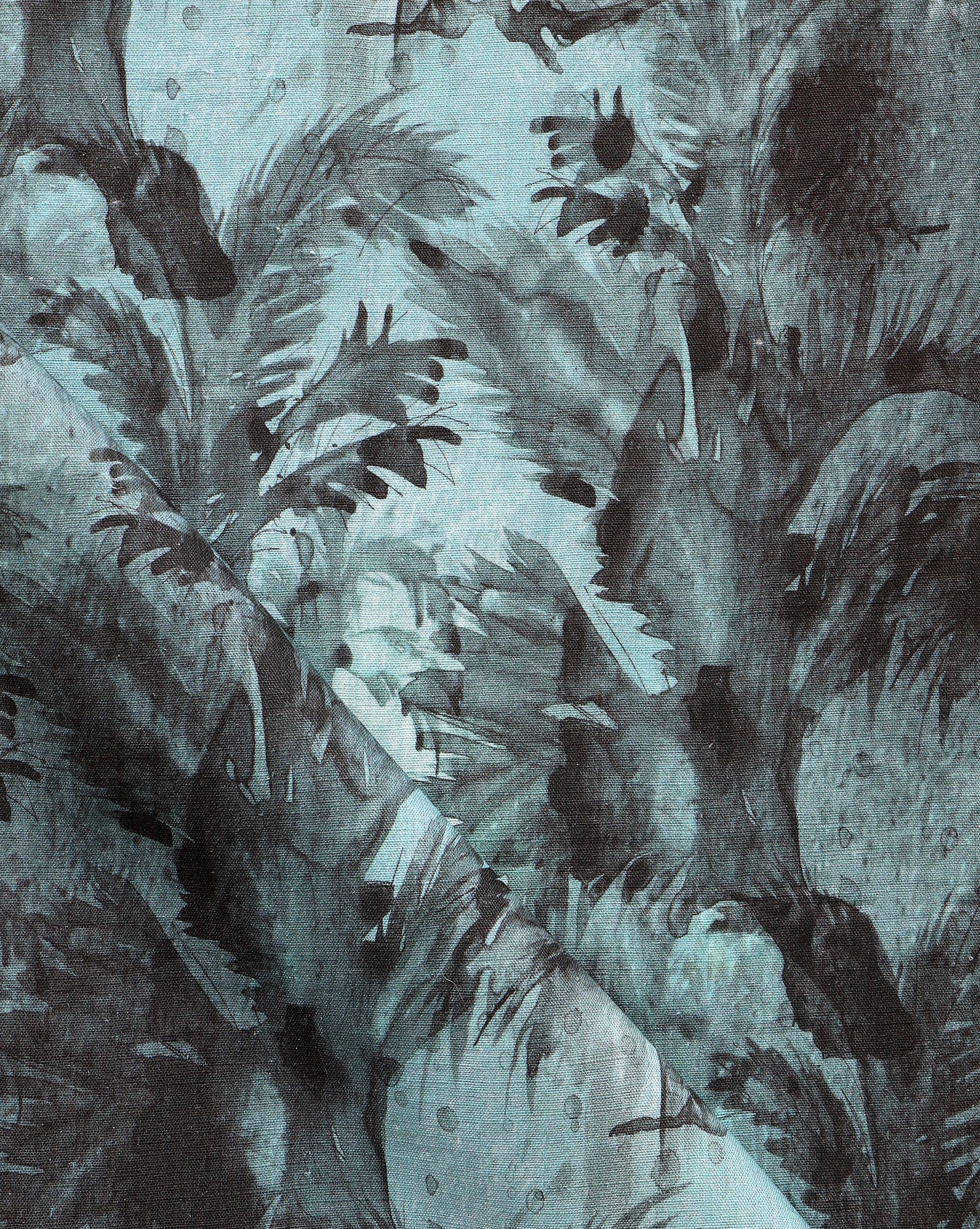 A blue and black fabric with a palm tree pattern on it