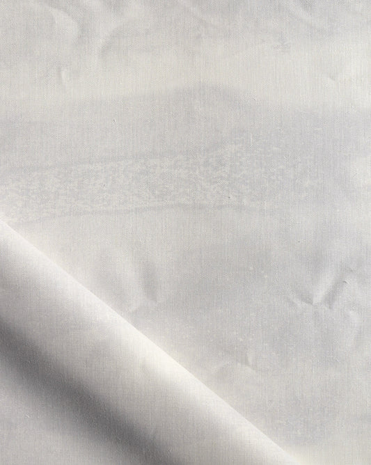 A luxurious fabric print from Eskayel, Delta in Sand is a colorway of beige and yellow.