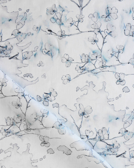 Dogwood Dreams is a botanical pen-and-ink pattern. As luxury fabric, Indigo is a colorway of blues.
