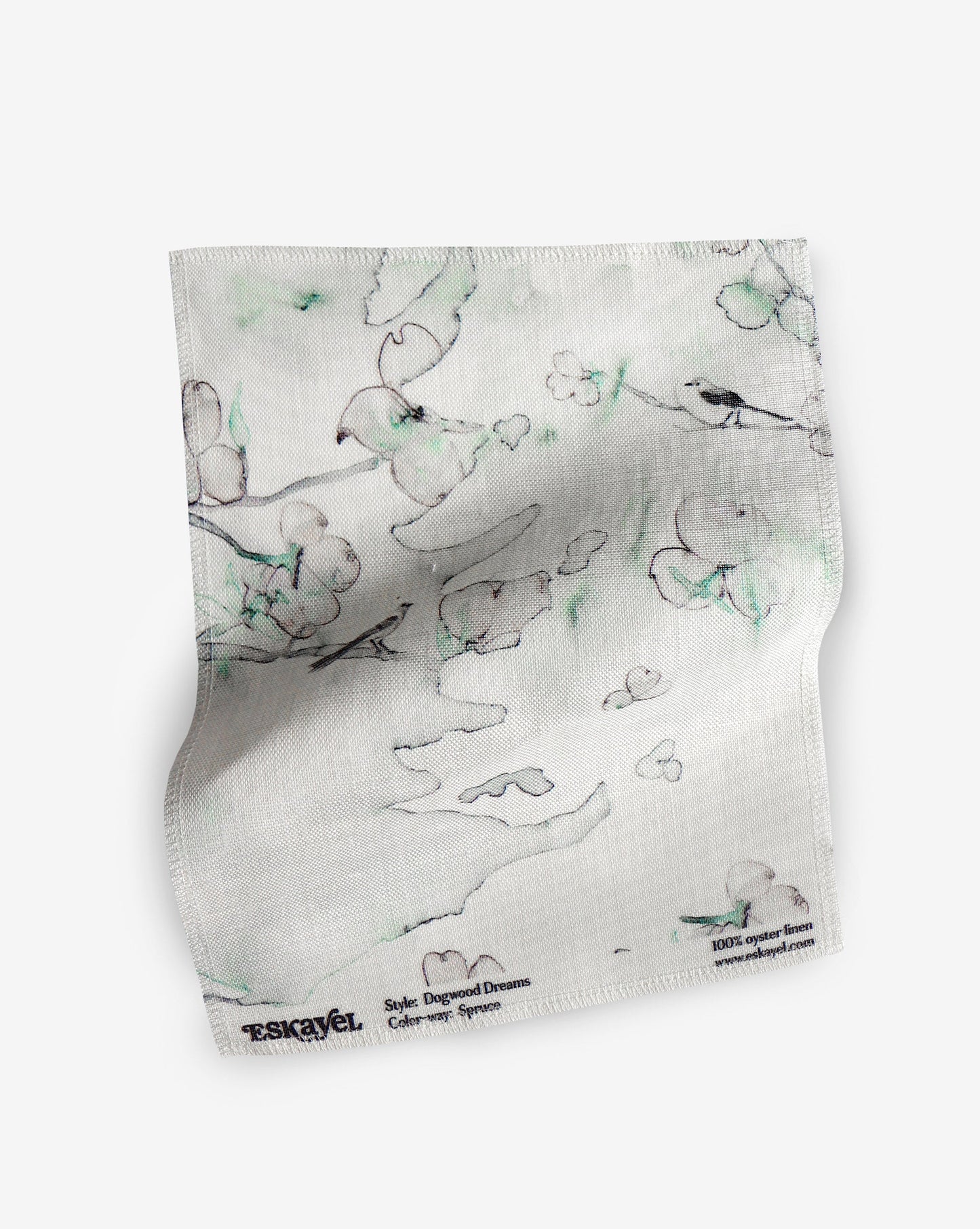 A fabric with our dogwood dreams pattern featuring a design of the dogwood tree, botanical elements, and birds in green, blue, and pink.