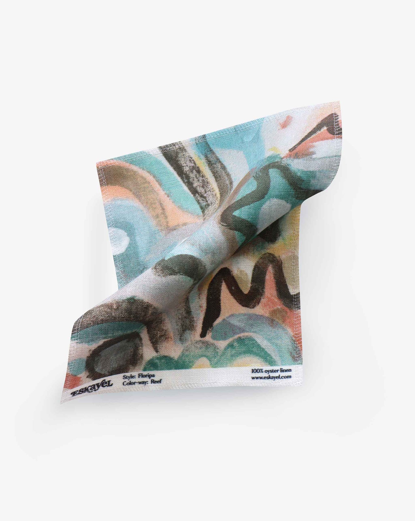 A colorful abstract patterned Floripa Fabric||Reef scarf with a tag showing "100% Eskayel Gordon Hull linen" details, laid flat on a white background.
