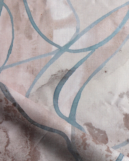 Watercolor strokes of beige, grey, and brown feature in Hibiscus Lily fabric in Amber.