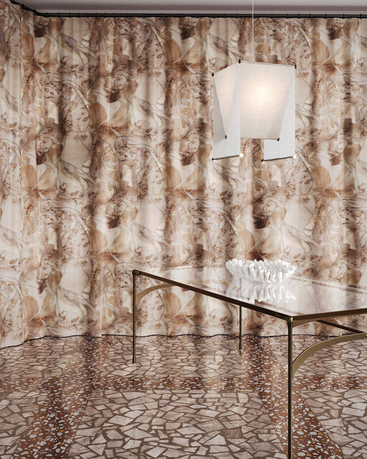 Hibiscus Lily Garnet fabric in a brown toned pattern used as curtains in a dining room.