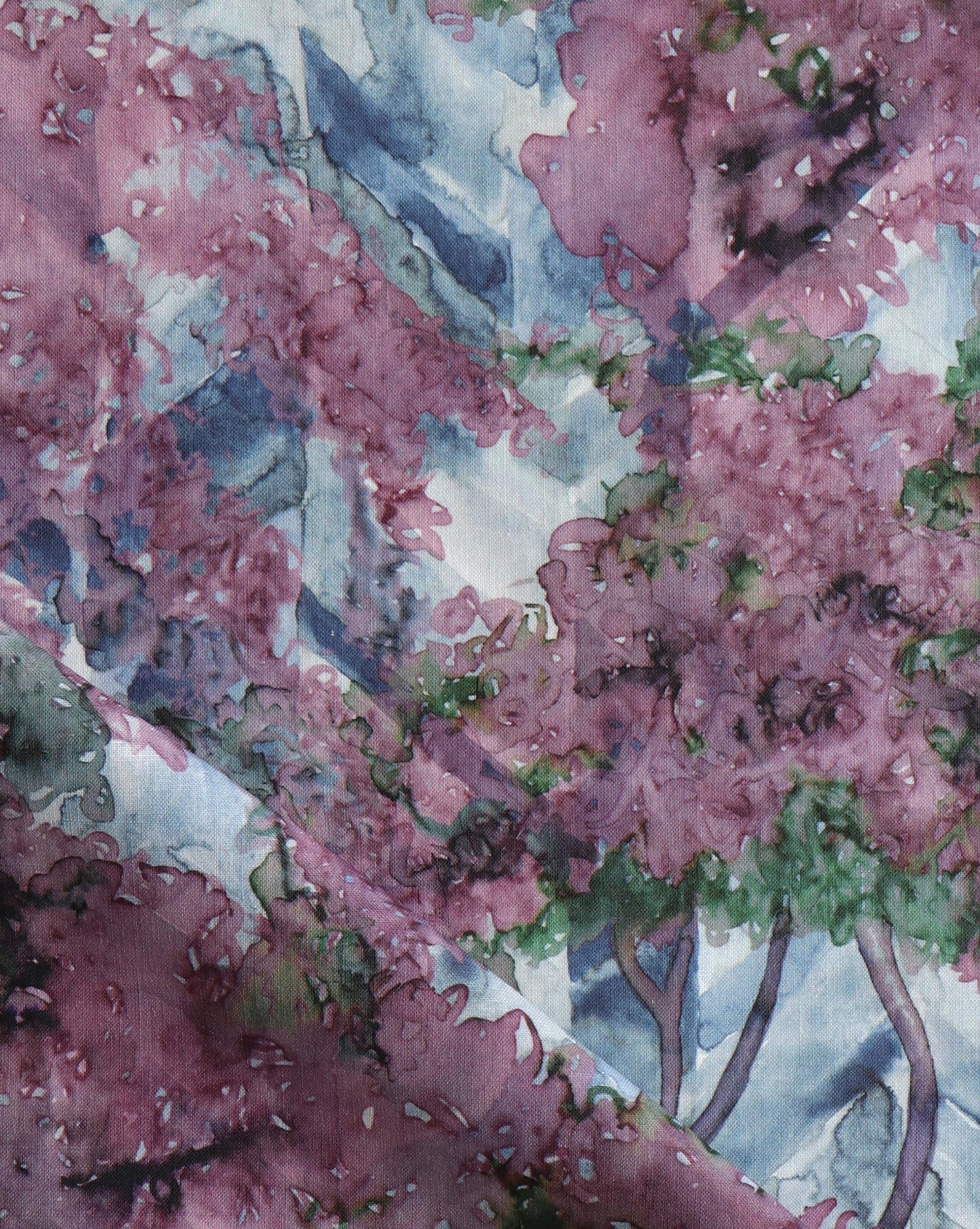 Featuring a floral study on chevrons, Inflorescence fabric in the Pomegranate colorway features vibrant shades of blue, green and magenta