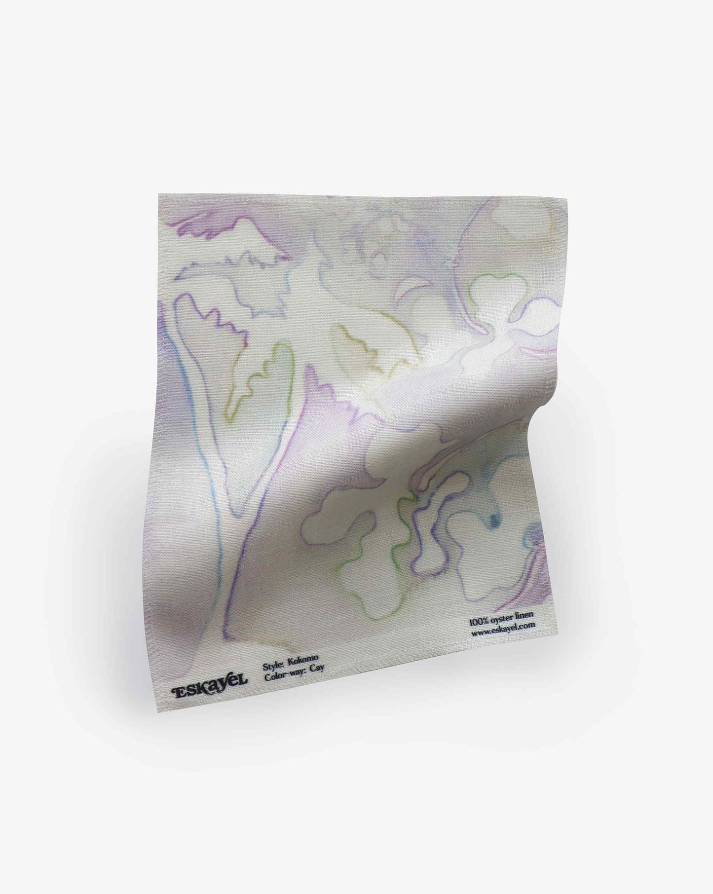 A high-end fabric, this Kokomo Fabric||Cay boasts pastel-colored abstract designs in blue, green, and purple, reminiscent of a tropical paradise. Featuring the Eskayel brand name and style details at the bottom corner, it's perfect for any sophisticated setting.
