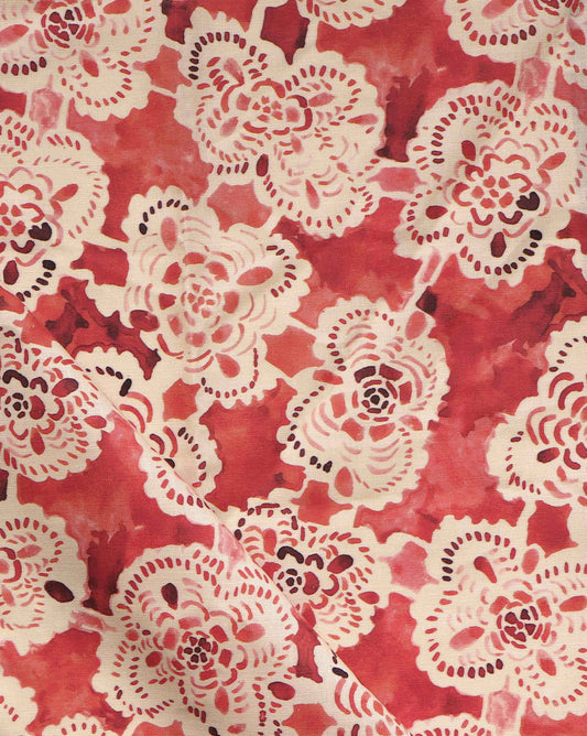 Based on lace, Margherita fabric in the Pomodoro colorway is a loose floral lattice pattern in warm red tones.