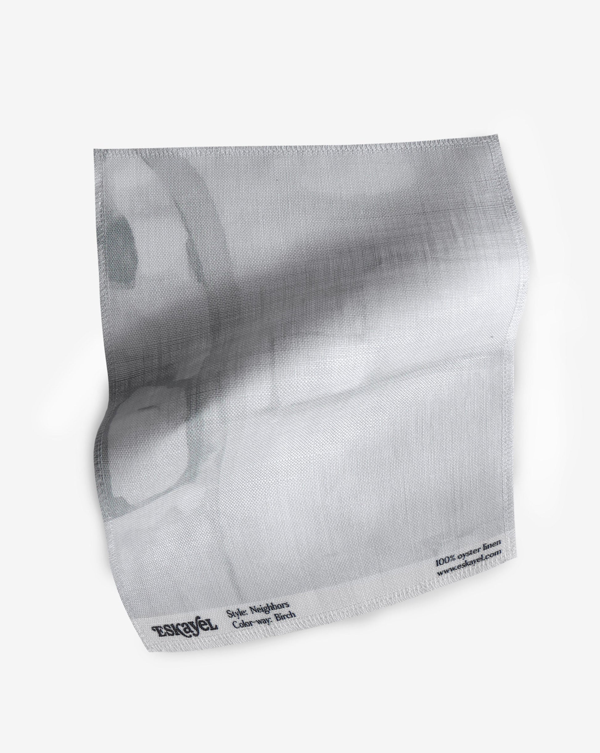 An order sample featuring a picture of a cat on a Neighbors Fabric Sample||Birch.