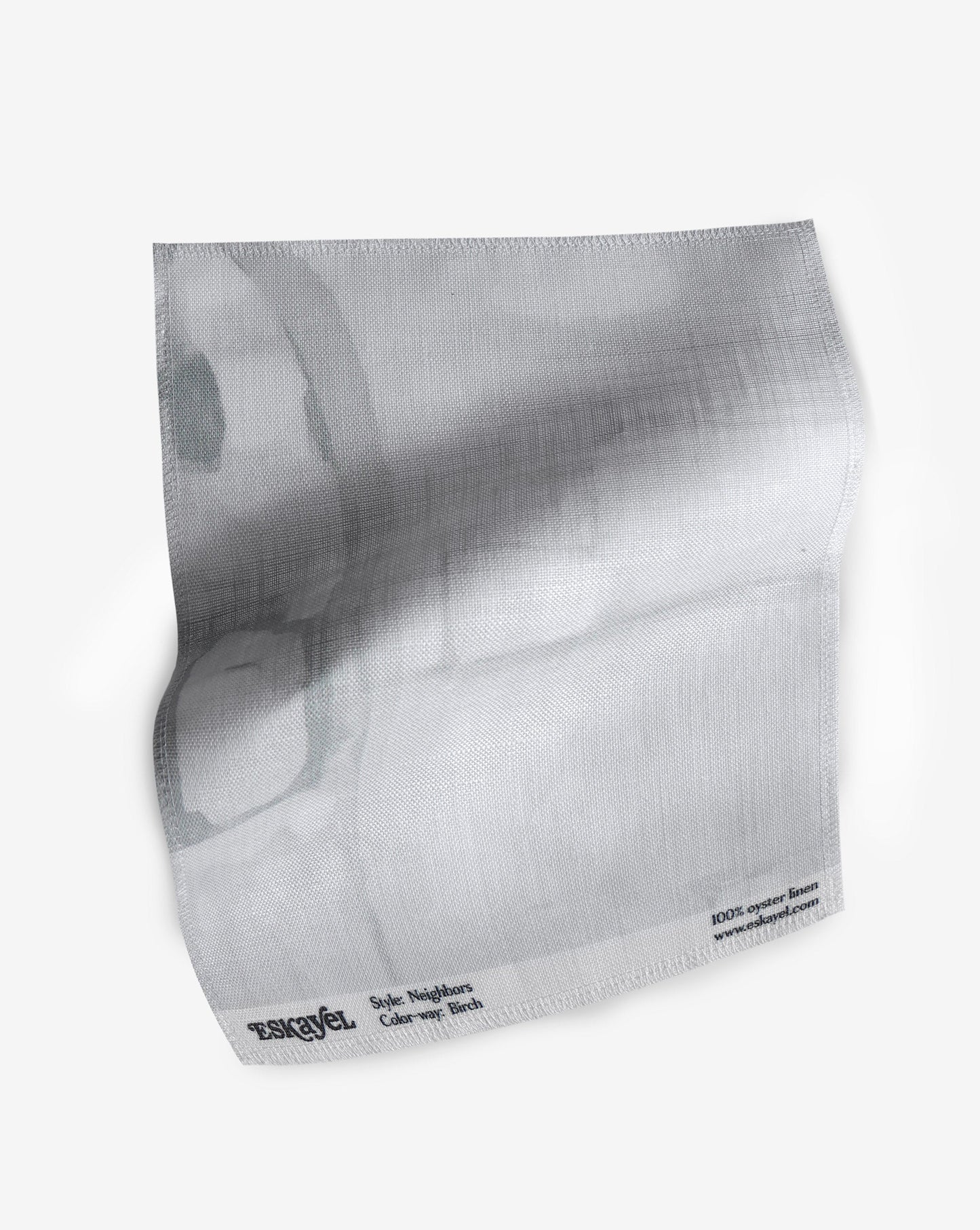A fabric with our neighbors pattern featuring a design of abstract shapes in grey and white.
