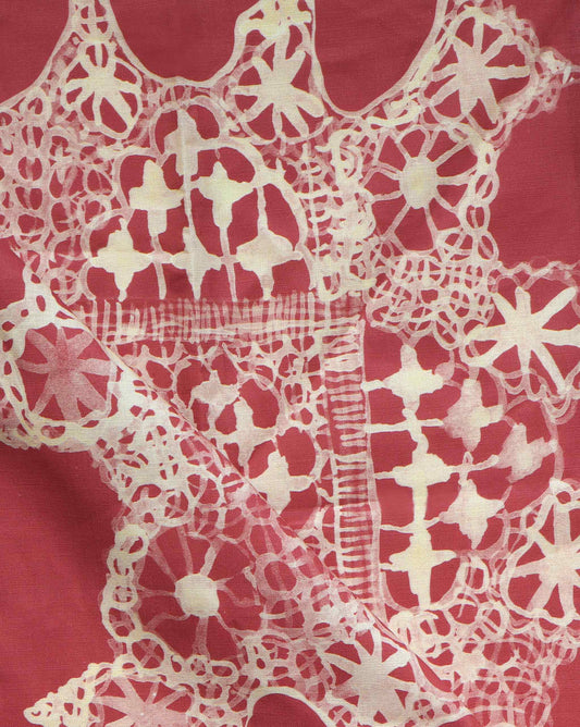 Depicting heirloom lace in watercolor, large-scale Nonna’s Lace fabric in Pomodoro is a palette of warm reds.