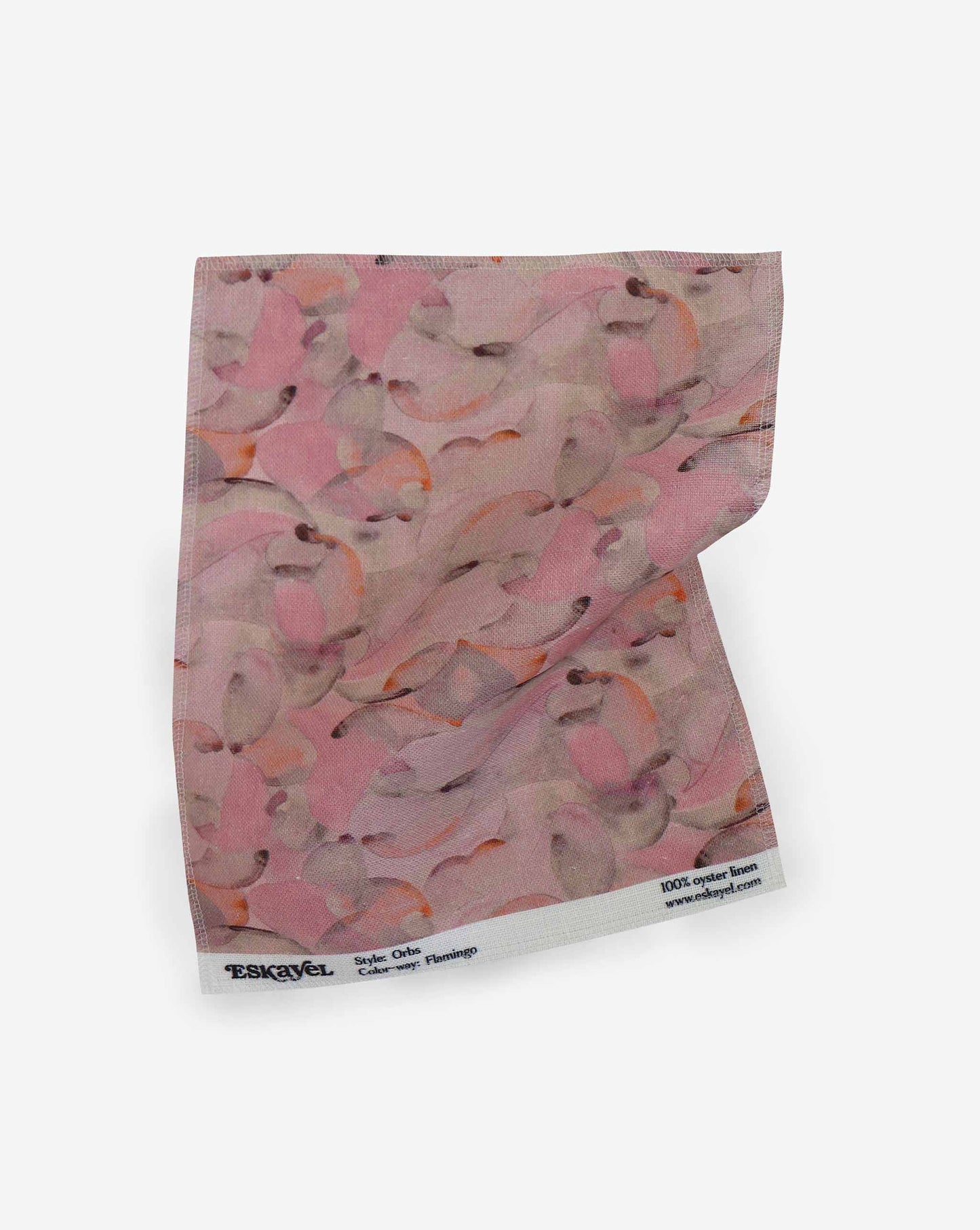 A fabric with our orbs pattern in the colorway flamingo featuring a design of curved and spherical watercolor forms fill the field, creating an overall feeling of kinetic, playful harmony in a palette of pink tones with orange throughout.