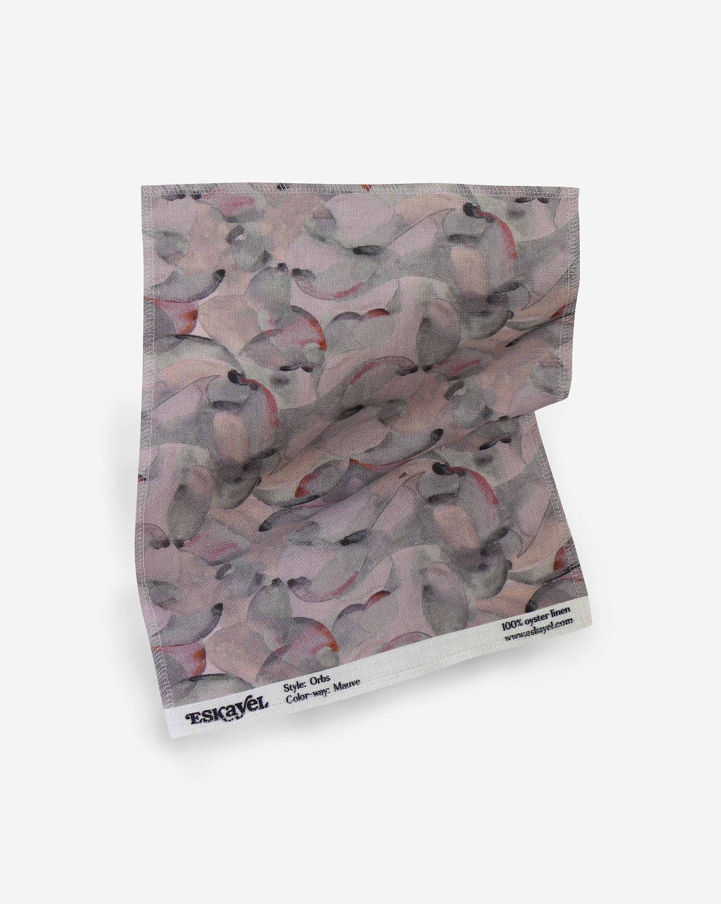 A fabric with our orbs pattern in the colorway pebble featuring a design of curved and spherical watercolor forms fill the field, creating an overall feeling of kinetic, playful harmony in a multicolor muted mauve palette.