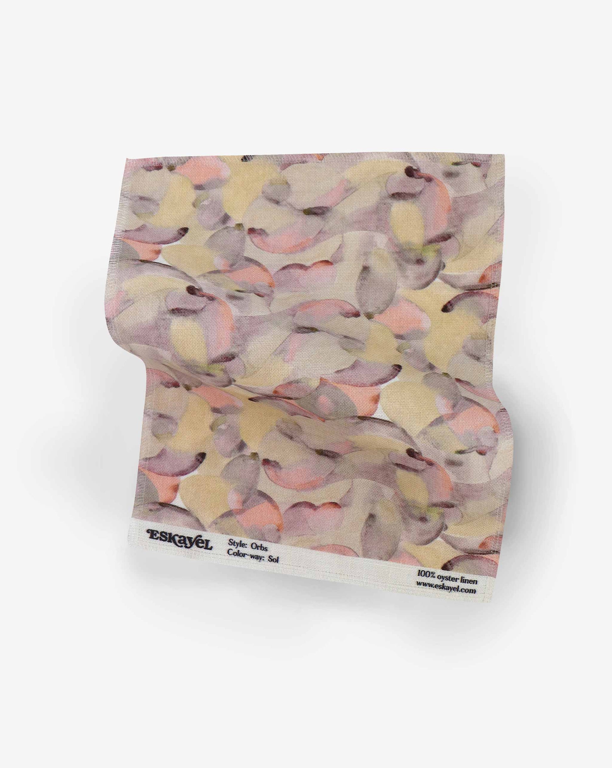 A sample Orbs Fabric Sample||Sol with a flower pattern on it.