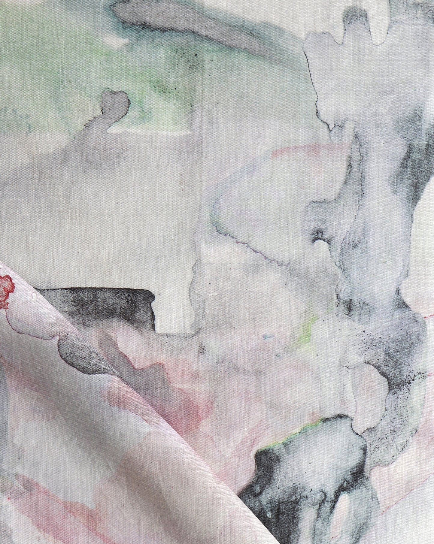 A close up of a watercolor painting on fabric