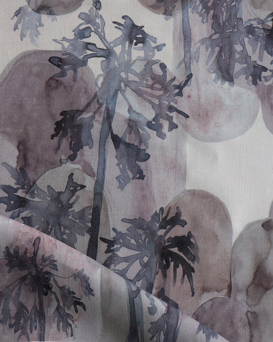 Depicting watercolor studies of a tropical tree, Papaya Arc fabric in our Pomegranate colorway features blue, purple and grey