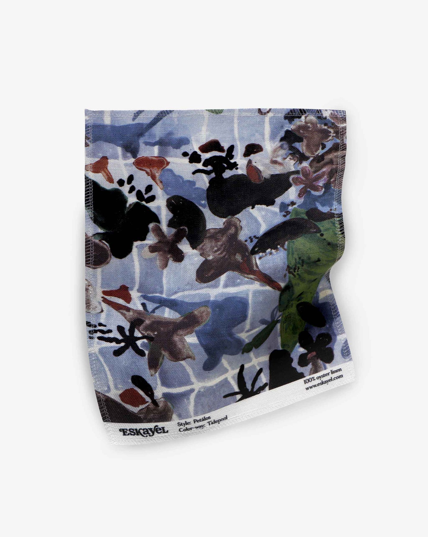 A fabric swatch of our Pétalos pattern in the color way tide pool with an immersive blue palette.