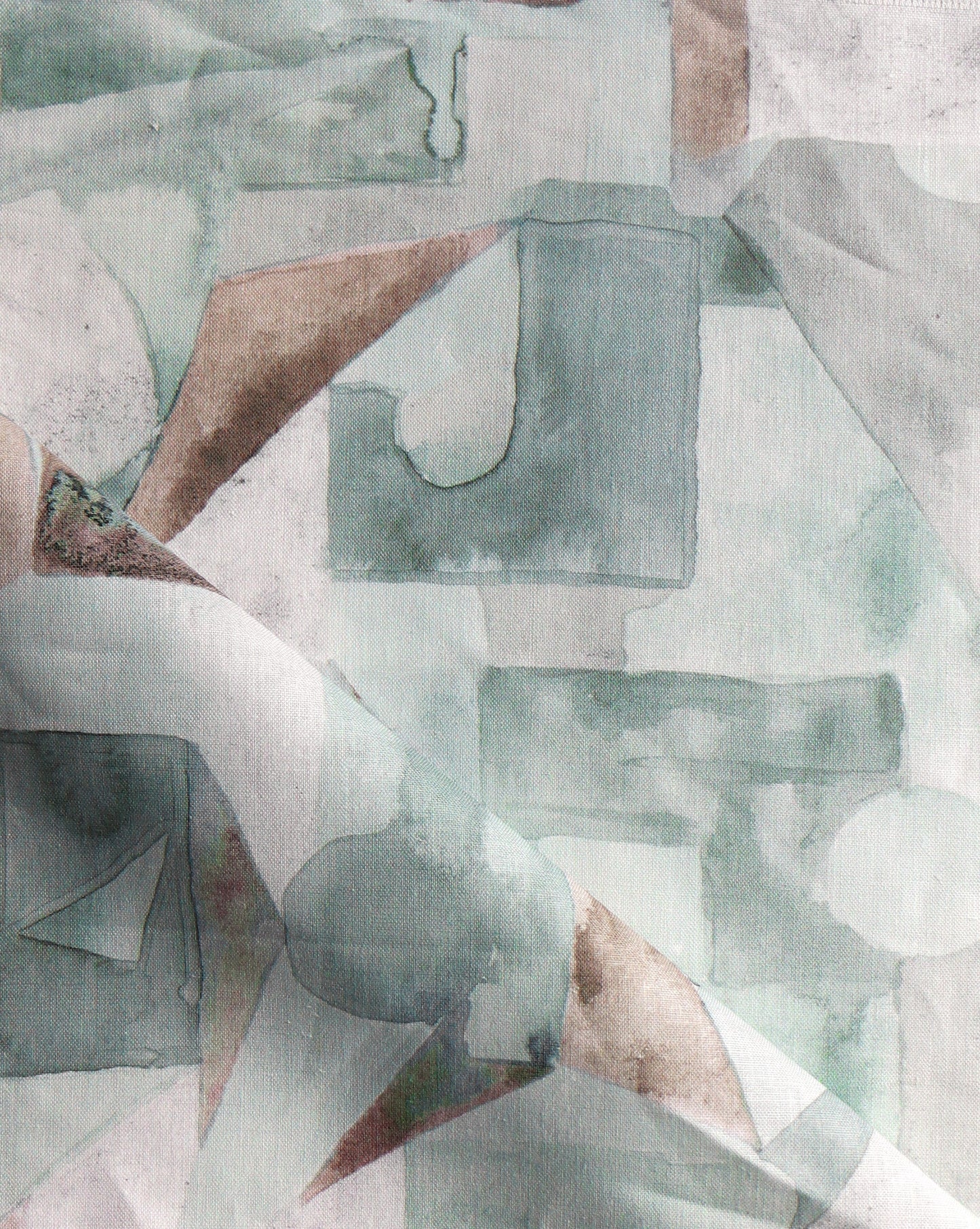 In Pieces fabric in Tourmaline, green blocks of pigment depict puzzle pieces.