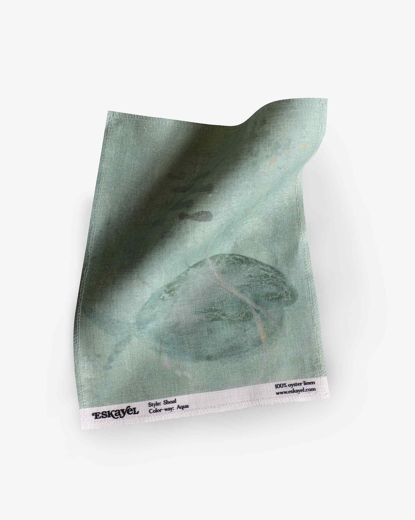 A swatch image of Eskayel’s Shoal print in the colorway Aqua on linen fabric incorporating tones of green with hints of yellow.
