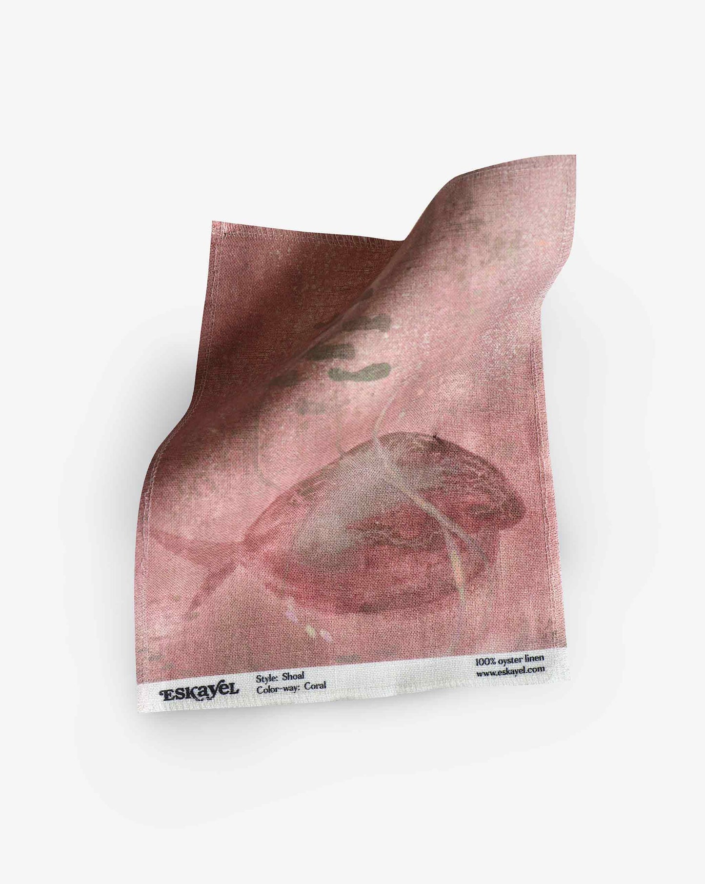 A swatch image of Eskayel’s Shoal print in the colorway Coral on linen fabric incorporating tones of red.