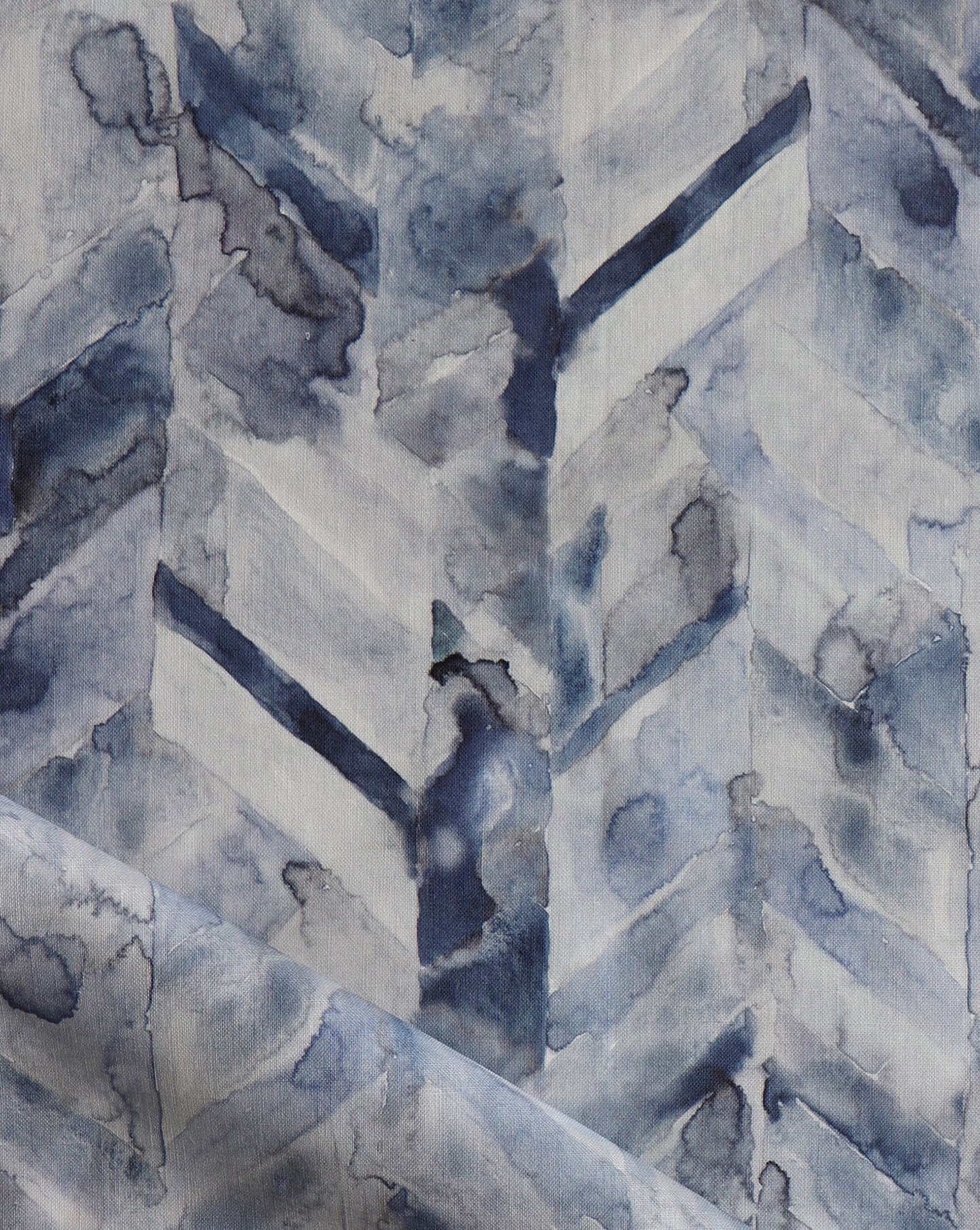 Luxurious Sorisa fabric presents a rich chevron pattern, with the Ocean colorway made up of a spectrum of blues