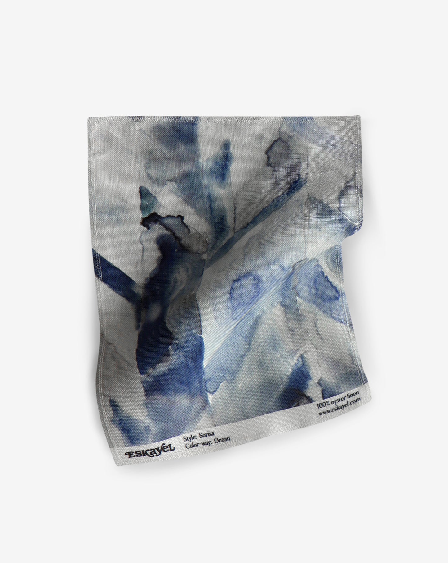 A paper with blue and white watercolors on it in the Sorisa Fabric Ocean colorway from Sorisa's Ecuatorial Geometry collection